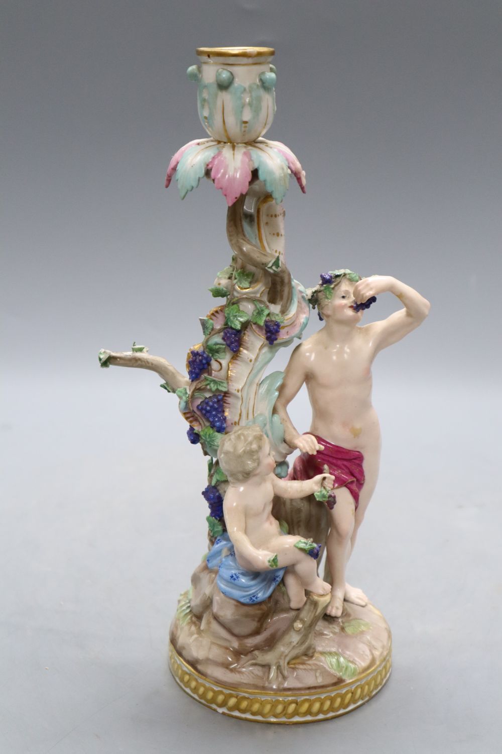 A Meissen Bacchus and cherub candelabrum, 19th century, H. 29cm